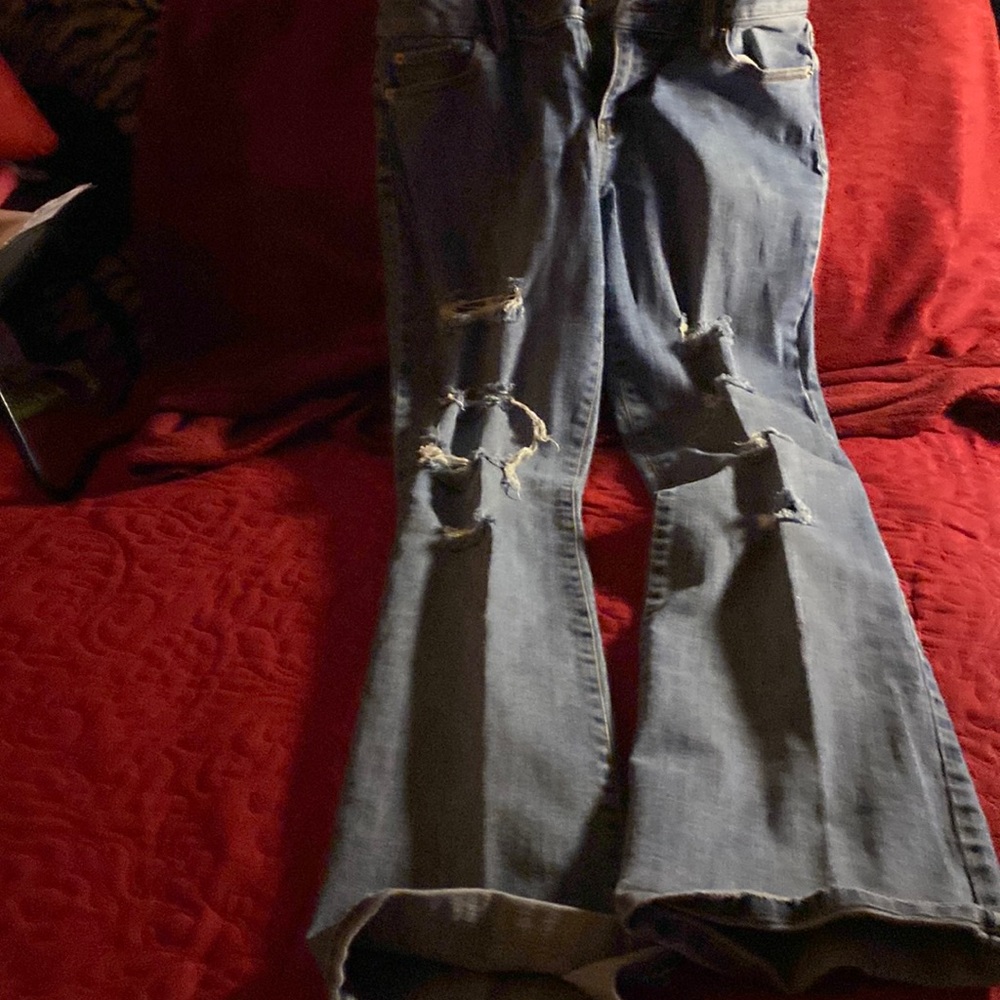Flare leg ripped faded jeans